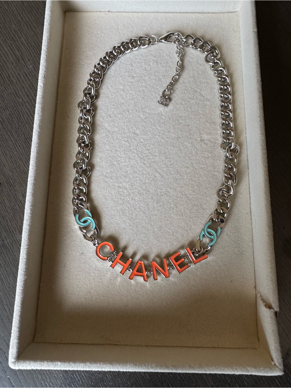 Silver chain necklace with orange & blue details
